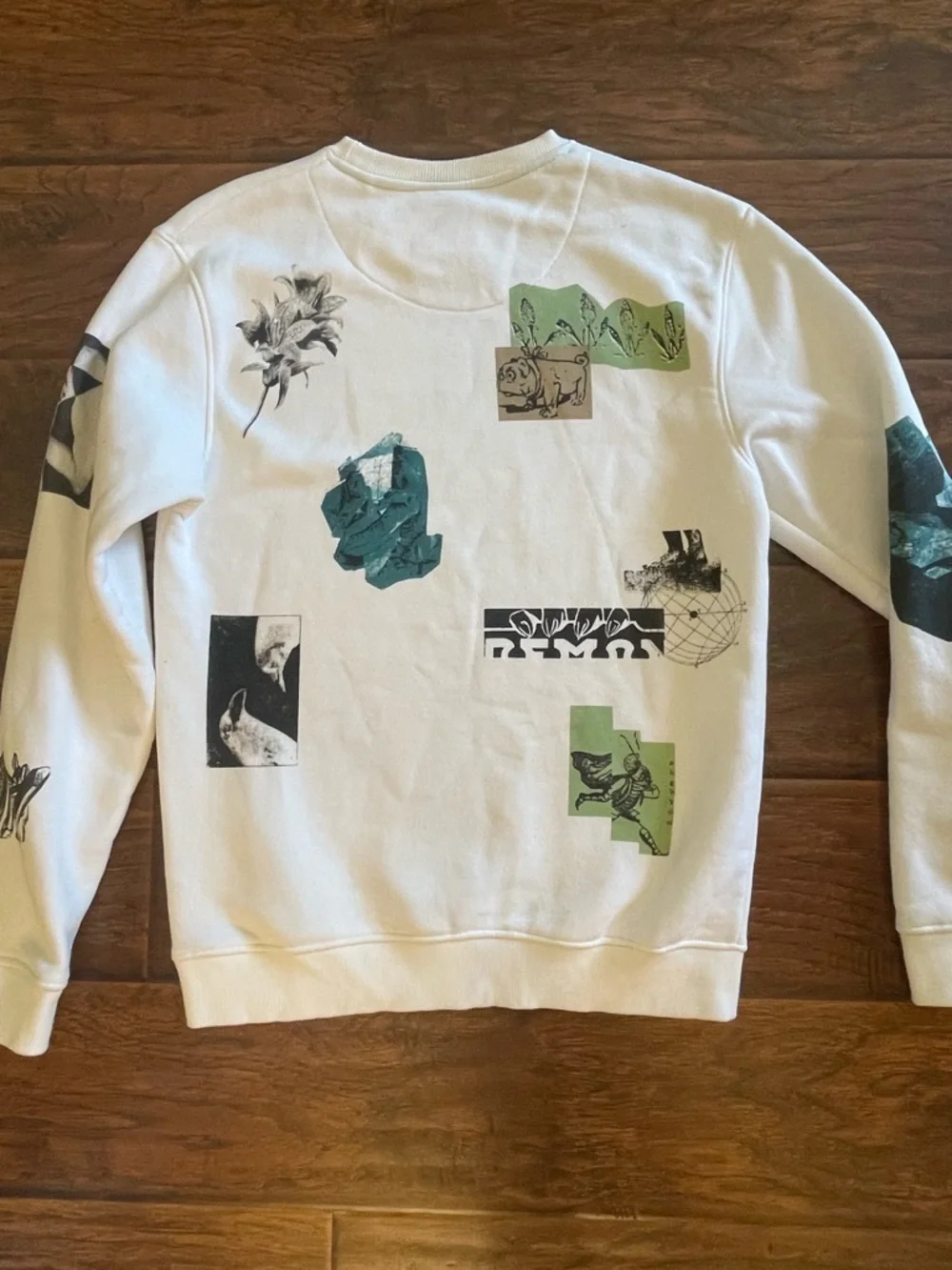 Denim & Flower White Crewneck Sweatshirt with Green Graphic Accents